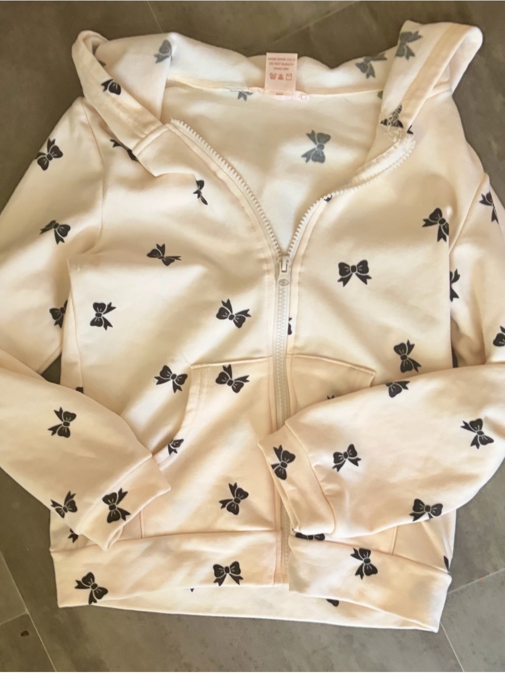 Girls' Cream Zip Hoodie with Black Bow Print